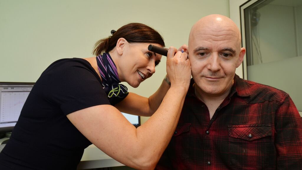 Audiologist Orla Walsh at Specsavers in the Henry Street arcade gives Conor Pope a hearing impairment.Photograph: Alan Betson