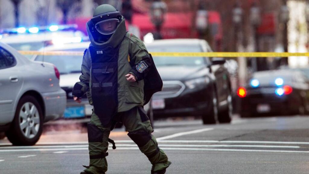 A law enforcement bomb technician walks away after preparing the controlled detonation of a suspicious object during a search for a suspect in the Boston Marathon bombing, in Watertown, Massachusetts, this morning. Photograph: Lucas Jackson/Reuters