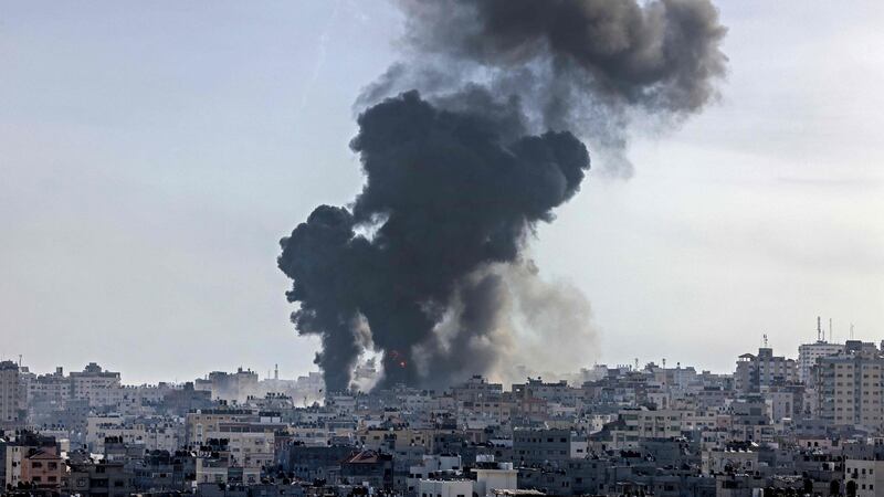 Smoke billows following an Israeli air strike on targets in Gaza City. Photograph:Mahmud Hams/AFP/Getty