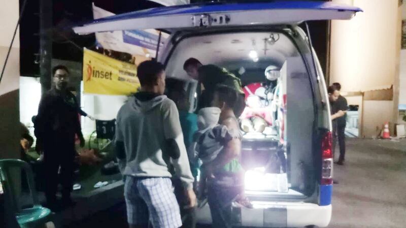 People next to an ambulance near the Golden Palace Hotel after an earthquake hit Lombok Island, Indonesia, on Sunday, in an image from social media. Photograph: Yayan Kopi/via Reuters