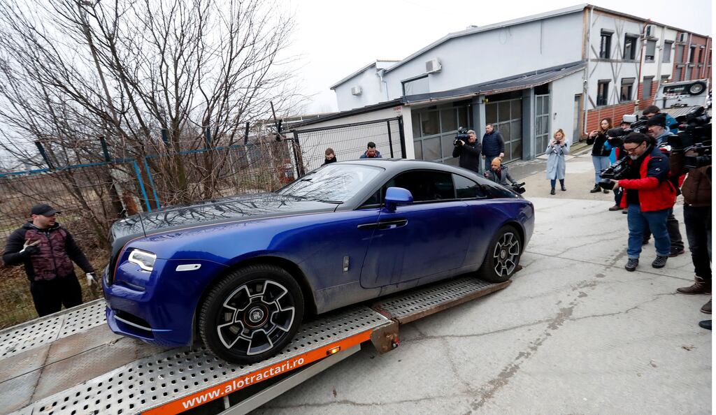 A Rolls Royce car belonging to Andrew Tate, is loaded onto a transport platform after being confiscated by Romanian law enforcement officers in Voluntari village, near Bucharest, Romania on Saturday. Photograph: Robert Ghement/EPA