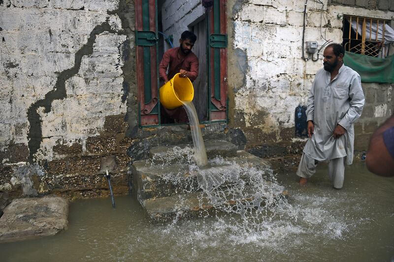 A resident removes water from his flooded house after heavy monsoon rains in Karachi. Photograph: Rizwan Tabassum/AFP via Getty Images