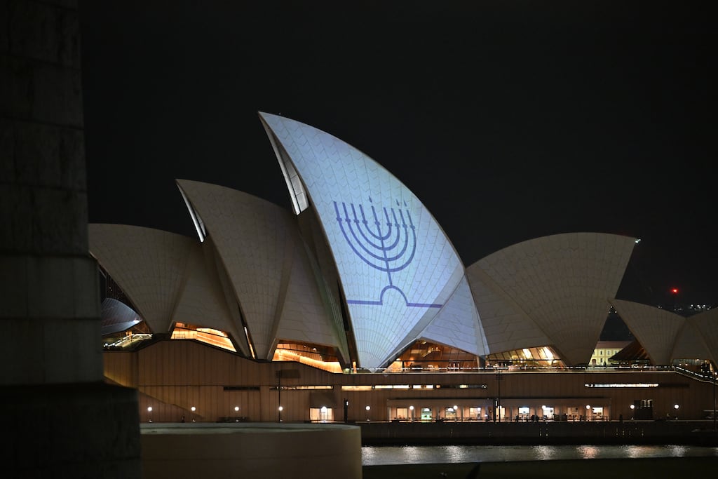 The Hanukkah menorah is projected onto the sails of the Sydney Opera House on December 15th, 2025. Photograph: James D. Morgan/Getty Images