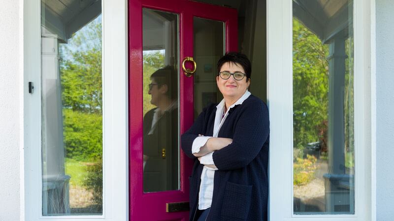 Cora Collins, Dulux colour consultant, outside her own front door which is painted in Raspberry Lane. Photograph: Oisin McHugh, True Media