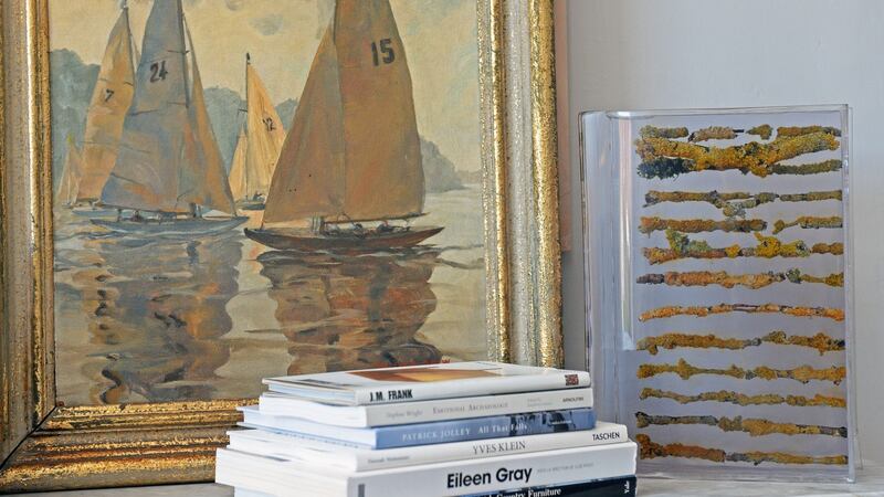 Pamela Drew painting with a resin book, alongside Sasha’s art books. Photograph: Eric Luke