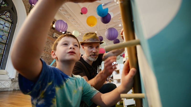 Barra and Cristoir O’Duill constructing a marble run at The Curiosity Carnival in Smock Alley, Dublin.  Photograph: Alan Betson / The Irish Times