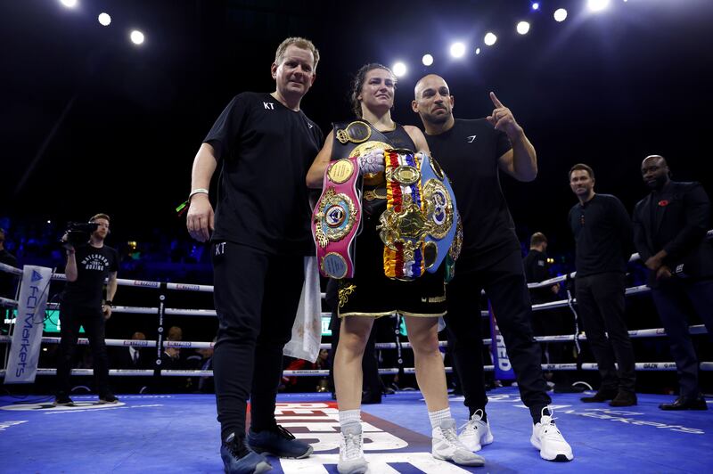 Katie Taylor celebrates with her belts after beating Karen Carabajal. Photograph: Steve Paston/PA Wire