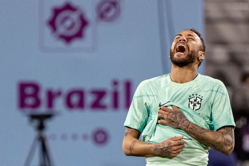 Brazil's Neymar enjoys a lighthearted moment at a squad training session in Doha. Manager Tite says the PSG star will face South Korea if he proves his fitness. Photograph: Martin Divisek/EPA