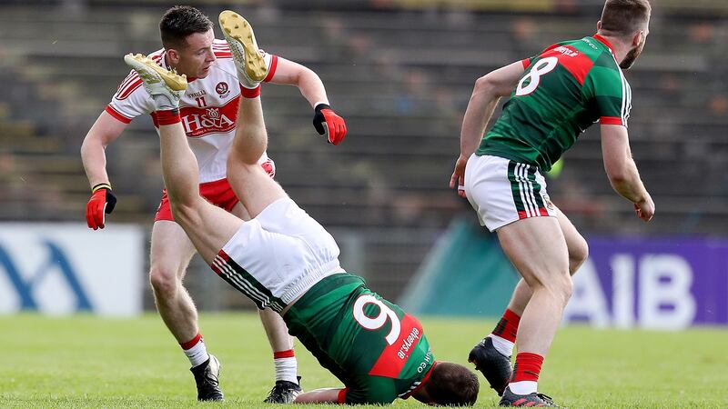 Lee Keegan lands awkwardly after winning a high ball. Photograph: Tommy Dickson/Inpho