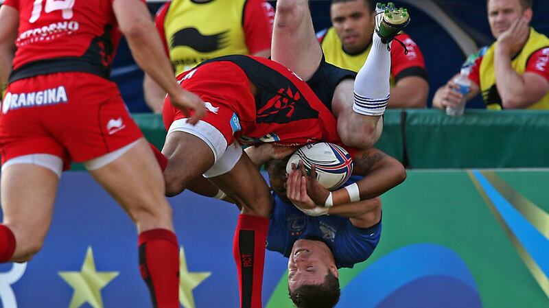 Leinster’s Brian O’Driscoll gets upended by Toulon’s Delon Armitage during the  2014 Heineken Cup quarter-final at Stade Felix Mayol . Photograph:   Billy Stickland/Inpho