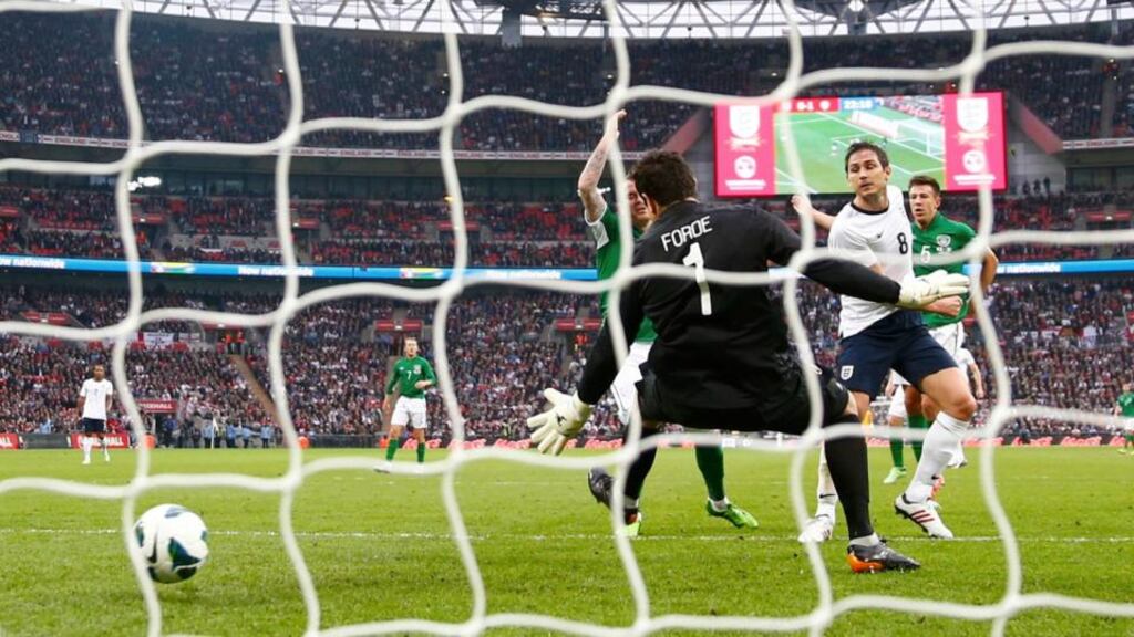 England’s Frank Lampard (second right) scores past Ireland’s goalkeeper David Forde at Wembley Stadium. Photograph: Eddie Keogh/Reuters