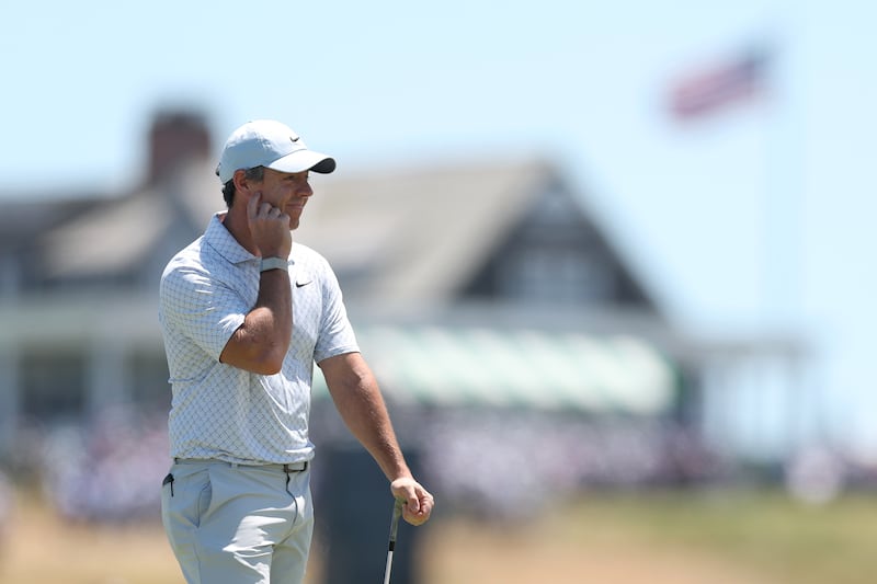 Rory McIlroy reacts after playing a shot on the first hole during the final round. Photograph: Christian Petersen/Getty Images