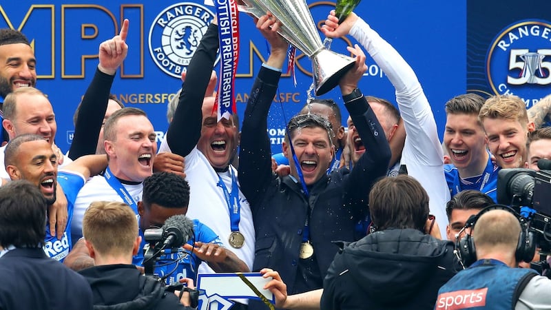 Rangers manager Steven Gerrard and his assistant Gary McAllister celebrate with the trophy after winning the Scottish Premiership at Ibrox in 2021. Photograph: Andrew Milligan/PA Wire