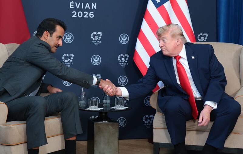 US president Donald Trump (R) shakes hands with the emir of Qatar, Sheikh Tamim bin Hamad Al Thani during a bilateral meeting on June 16, 2026 in Evian-les-Bains, France. Photograph: Anna Moneymaker/Getty Images