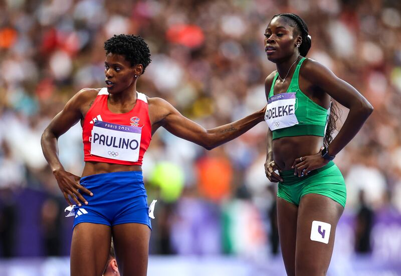 Ireland’s Rhasidat Adeleke with 400m champion Marileidy Paulino of the Dominican Republic after the race in the Stade de France. Photograph: Morgan Treacy/Inpho