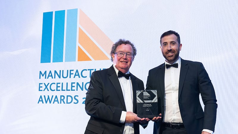 Prof Ger Kelly, committee member at Irish Manufacturing Council, presents the excellence in health & safety award to Declan Lynch, Aerogen