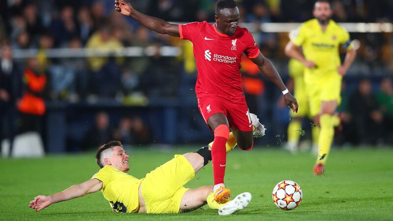 Liverpool’s  Sadio Mane  evades a tackle from Juan Foyth of Villarreal  before scoring his side’s third goal  during the Champions League semi-final second leg at the  Estadio de la Cerámica. Photograph:  Eric Alonso/Getty Images