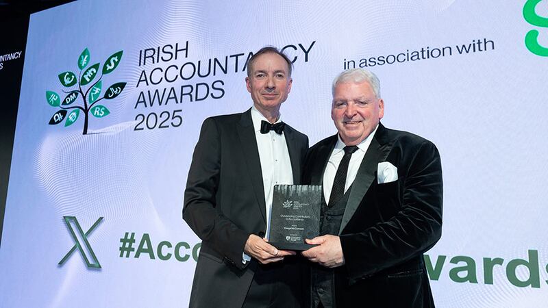 Barry Dempsey, chief executive, Chartered Accountants Ireland, presents the outstanding contribution to accountancy award to Feargal McCormack, AAB