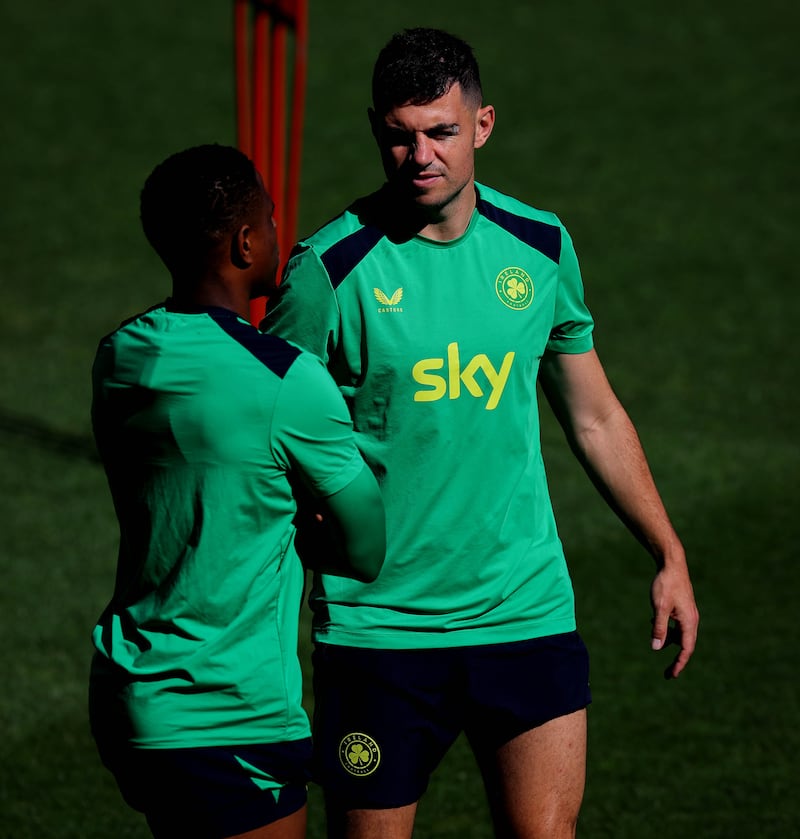 Chiedozie Ogbene and John Egan during Ireland training at the TSC Arena in Bačka Topola. Photography: Ryan Byrne/Inpho