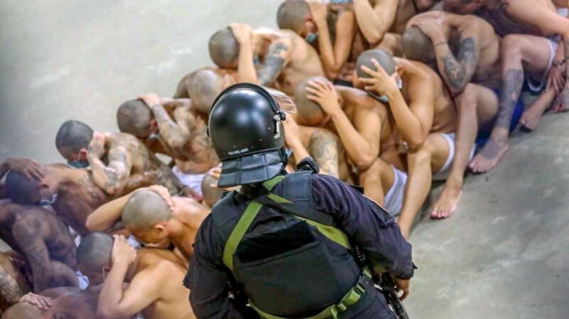 Gang members secured during a police operation at Izalco jail. Photograph: El Salvador President Press Office via Reuters