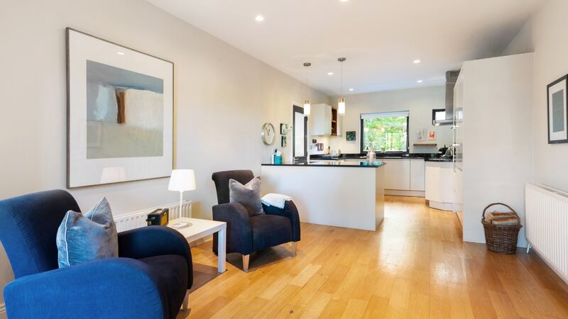 Informal living room looking towards the kitchen at the front