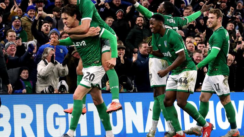 Sheffield Wednesday celebrate after Adam Reach (L) opened the scoring against Brighton. Photograph: Gareth Fuller/PA