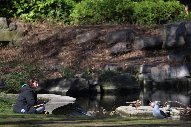 People, and wildlife alike, enjoyed the sunshine in Dublin's St Stephen's Green on Sunday.  Photograph: Dara Mac Dónaill