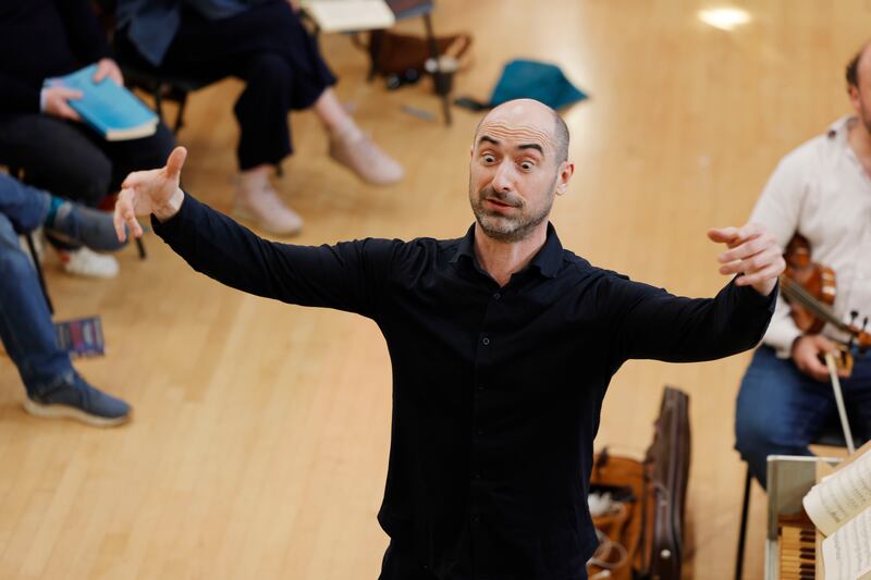 Conductor Peter Whelan directs musicians during rehearsal. Photograph: Alan Betson 