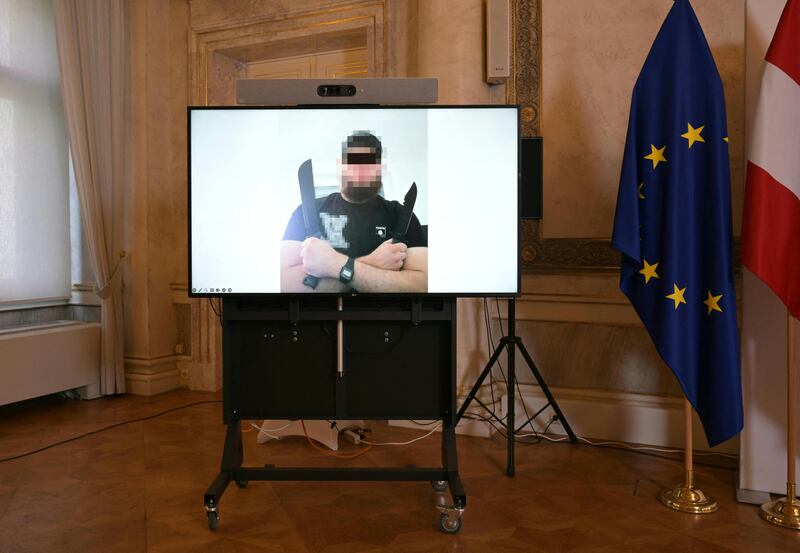 A screen on the sidelines of a press conference  at the foreign ministy in Vienna displays a photograph of a man arrested in connection with an Islamist attack plot that caused the cancellation of shows by Taylor Swift. Photograph: Roland Schlager/AFP via Getty Images