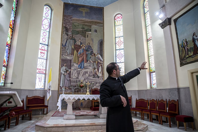 Fr Bashar Fawadleh inside a church in Taybeh, a Christian town in the occupied West Bank