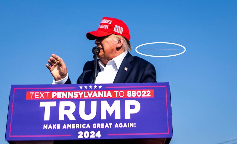 Former president Donald Trump as gunshots are fired at his campaign rally. Photograph: Doug Mills/The New York Times.
                      