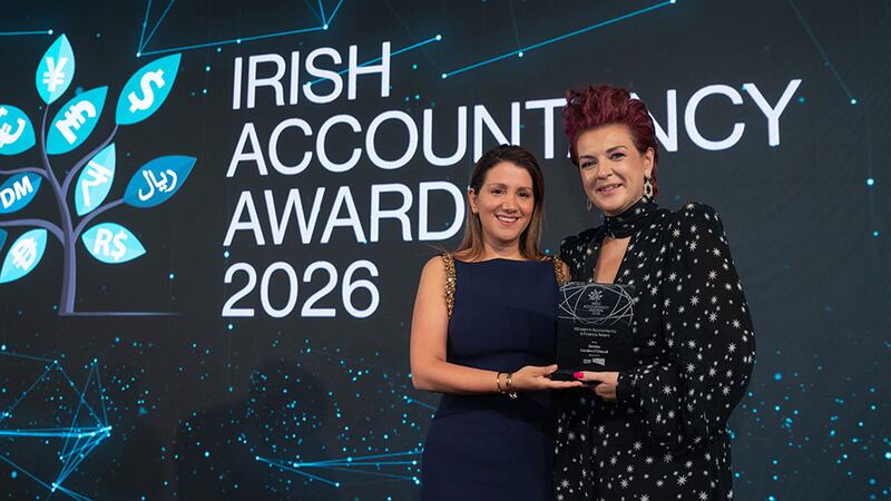 Rosa Martinez Borrell, chief investment officer at ETL Global Ireland, presents the women in accountancy & finance award to Caroline O'Driscoll, Deloitte