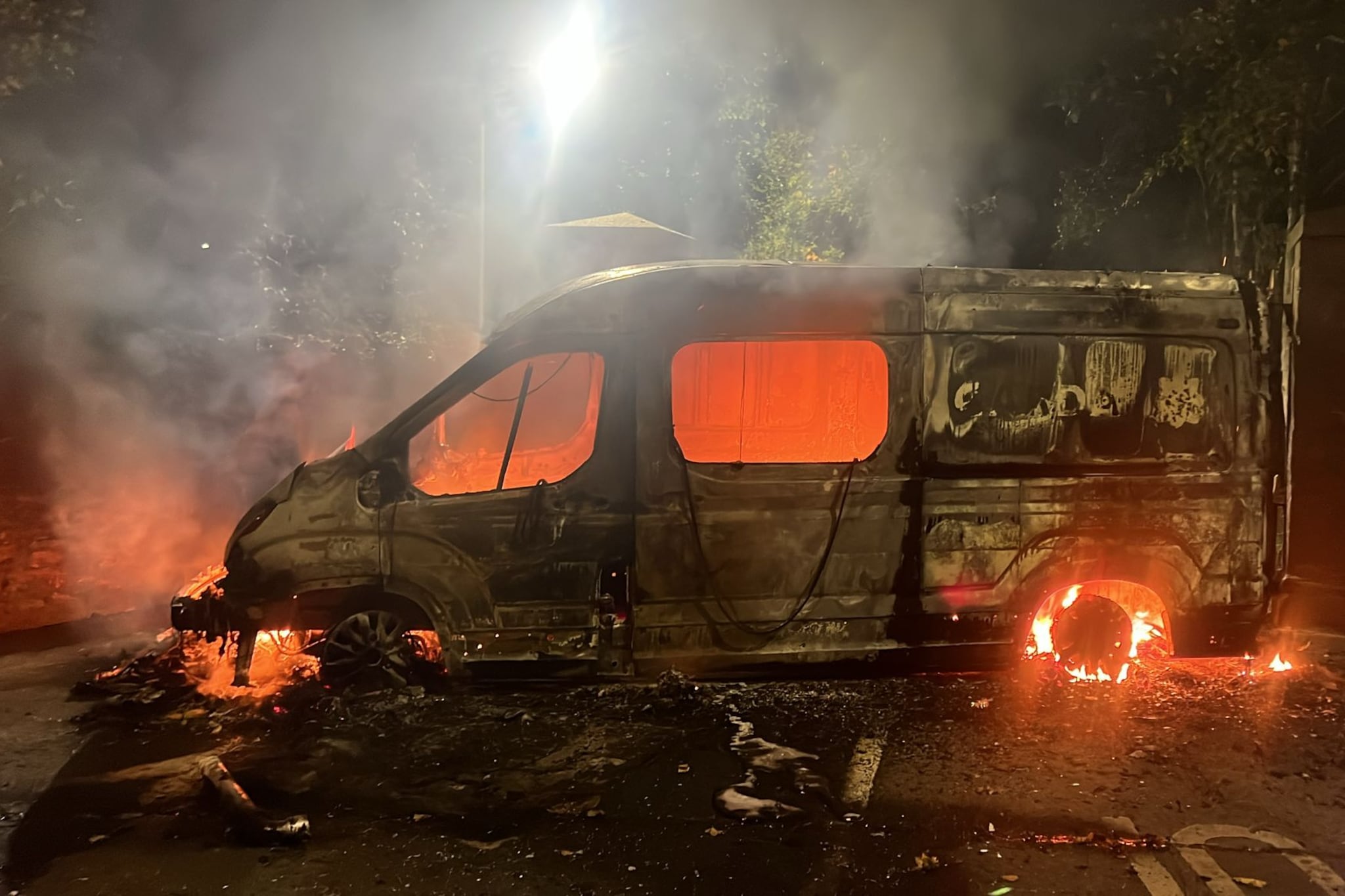 ‘Hold your ground’: Six arrested as Garda van burned at Citywest Hotel