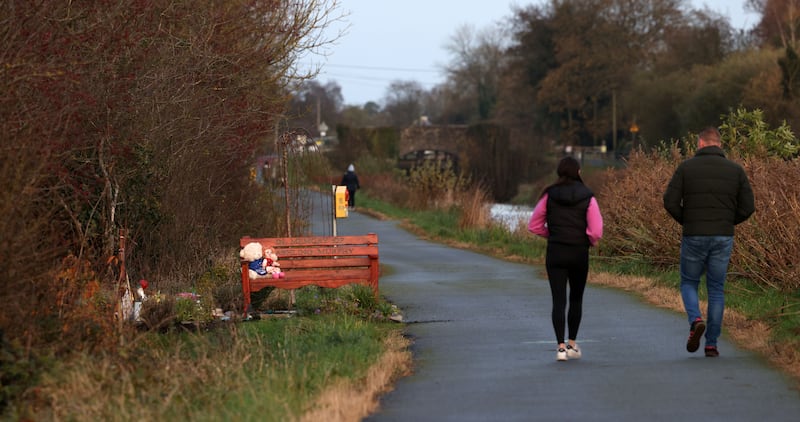 Walkers pass the memorial to Ashling Murphy. Photograph: Laura Hutton