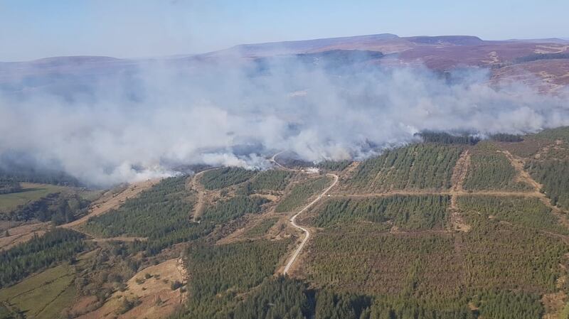 It took five fire crews and a helicopter two days to put out the fire in a forest at Dun Mountain in Aughnasheelin near Ballinamore. Photograph:  Chris Shield, Member/Coillte Fire Fighting Team