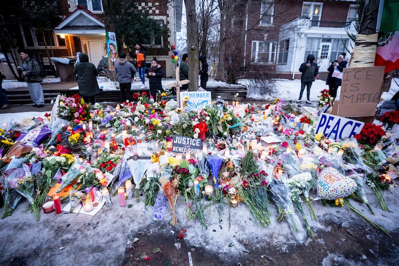 People pay their respects at a memorial honouring Renee Nicole Good, who was fatally shot in Minneapolis. Photograph: Christopher Katsarov/The Canadian Press via AP