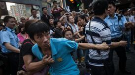 Scuffles break out in Hong Kong as protester numbers fall