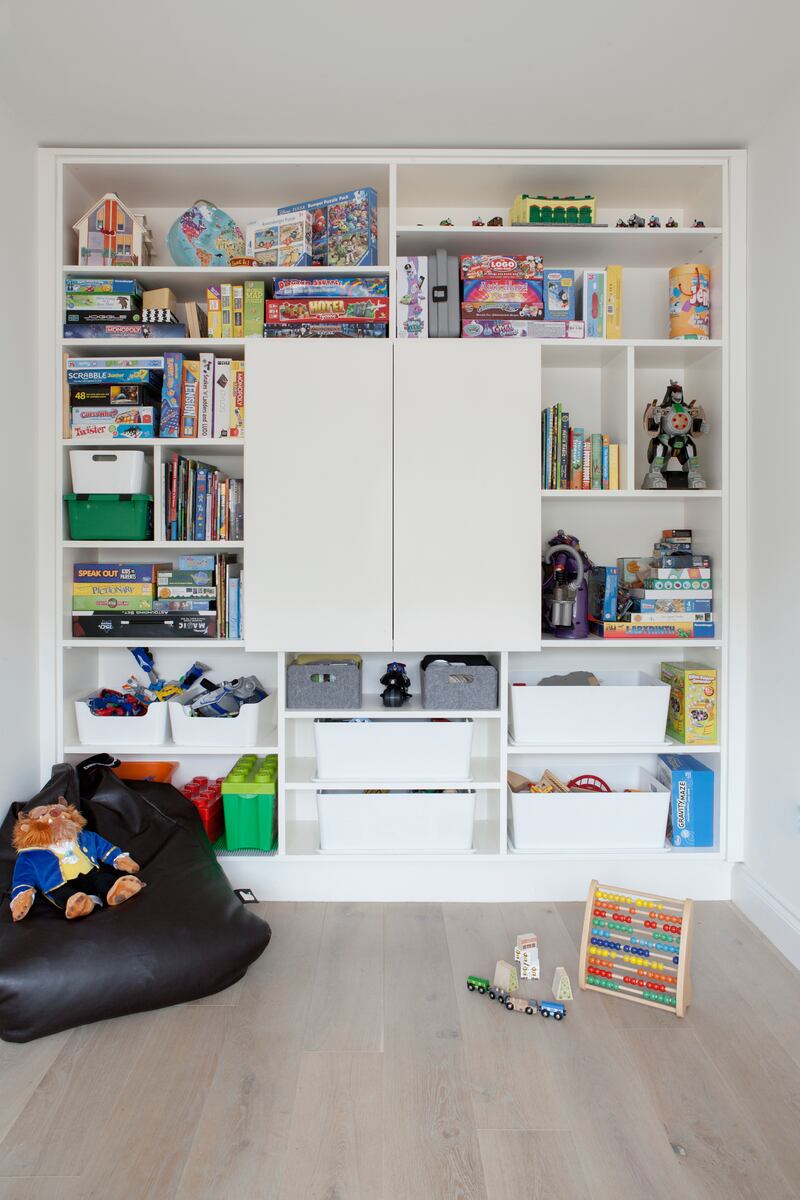 Use as much vertical wall space as possible for storage and keep the floor space clear for play. Photograph: Ruth Maria Murphy