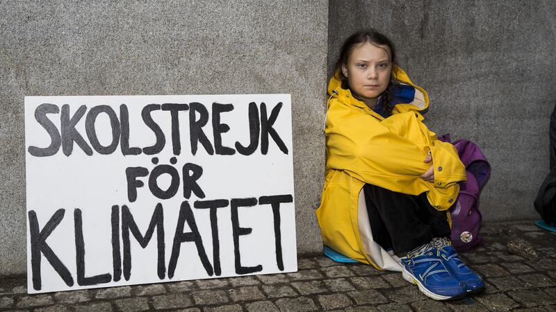 August 2018: Greta Thunberg (then 15) leads a school strike outside the Swedish parliament building in Stockholm to raises awareness for climate change. Photograph: Michael Campanella/Getty Images