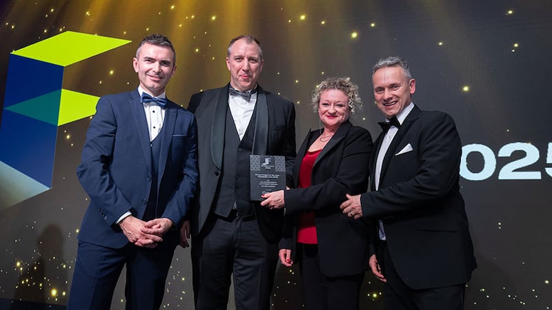 Iain Wogan, CEO at Whiteriver Group, presents the fit out project of the year - hospitality (over €500k) award to Millimetre Design and Creighan Contracts 