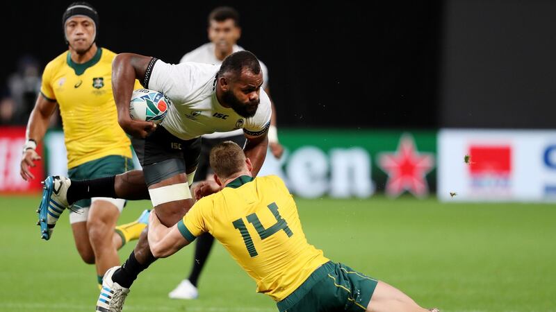 Australia’s Reece Hodge tackles Peceli Yato of Fiji  during the Rugby World Cup  Group D game  at the Sapporo Dome. Photograph:  Shaun Botterill/Getty Images