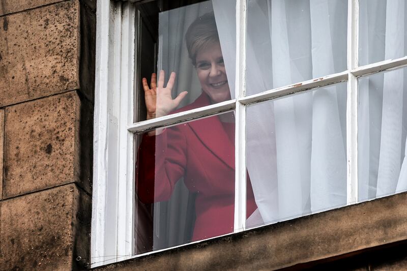 Nicola Sturgeon waves from a window after holding a press conference to announce that she is stepping down as SNP leader. The race to succeed her has at times been brutal.  Photograph: Jeff J Mitchell/Getty Images