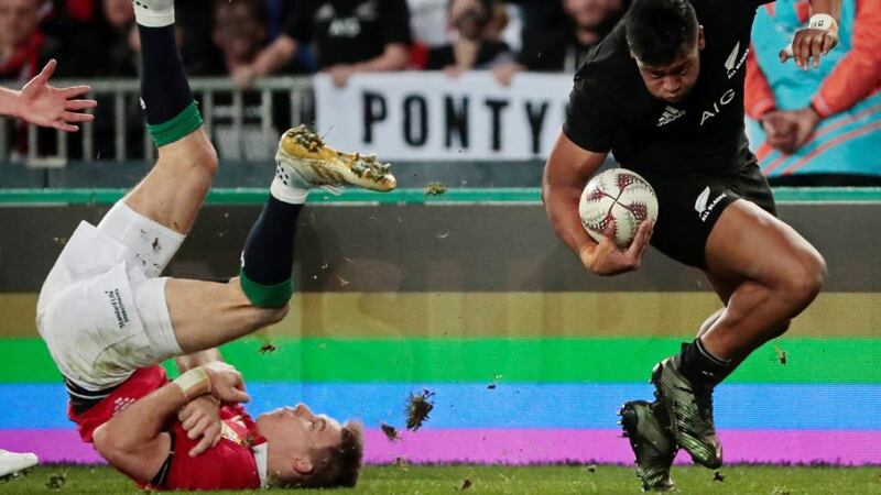 All Blacks winger Julian Savea in action against Lions’ Liam Williams. Photograph:  Jason Reed/Reuters