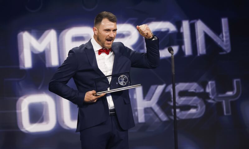 Polish amputee soccer player Marcin Oleksy of Warta Pozna accepts his Fifa Puskas Award on stage at the The Best Fifa Football Awards 2022 ceremony in Paris. Photograph: Yoan Valat/EPA