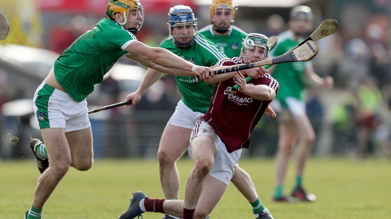 Galway’s Cathal Mannion is tackled by Limerick’s Dan Morrissey. Photograph: Laszlo Geczo/Inpho