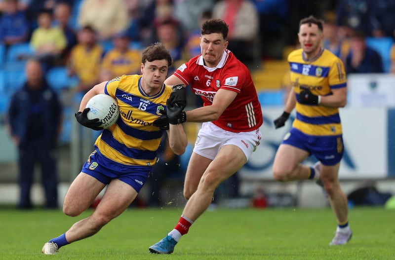 Cork’s Seán Brady tackles Ben O’Carroll of Roscommon during the game in Portlaoise. Photograph: Leah Scholes/Inpho