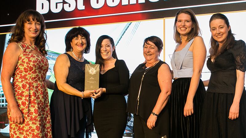 Sean Reid, Commercial Director, Citywest Hotel presents the Best Event Team award to Jane Gallagher, Cogs & Marvel.