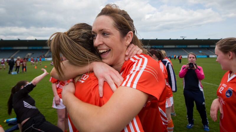 Armagh’s Caroline O’Hanlon celebrates with Sharon Reel after winning the league in 2015. Photograph: Ryan Byrne/Inpho