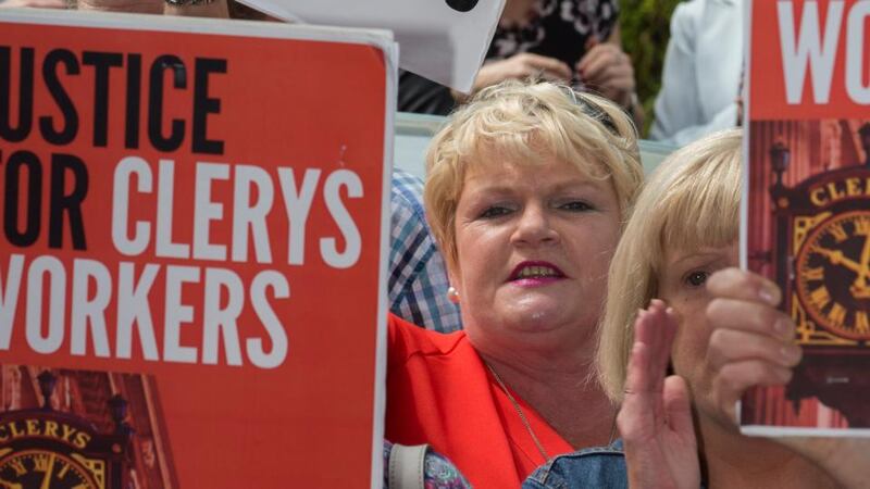 Liz Meade, who would have been with Clerys for  22 years this September, with other former staff  protesting outside the offices of  new owners Natrium on Harcourt Terrace on Friday. Photograph: Fergal Phillips