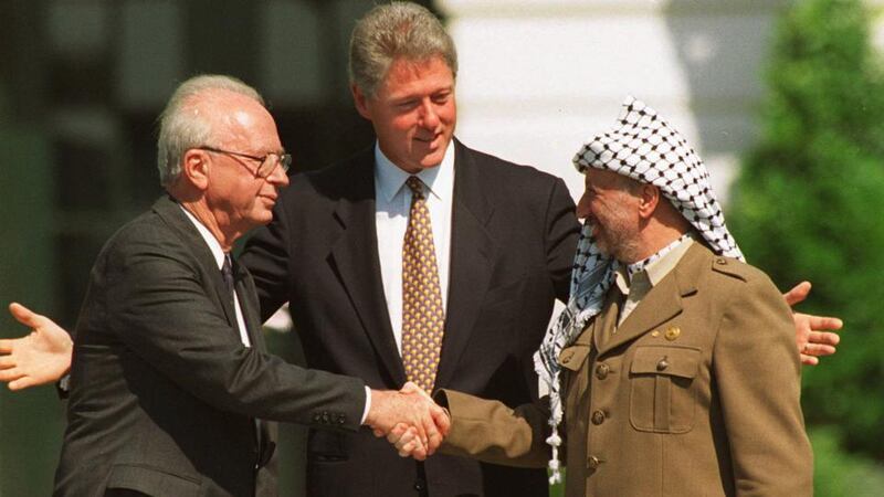 US president Bill Clinton presides over a White House ceremony in 1993 to mark the Israeli-Palestinian peace accord, with Israeli prime minister Yitzhak Rabin and PLO chairman Yasser Arafat. Photograph: AP Photo/Ron Edmonds